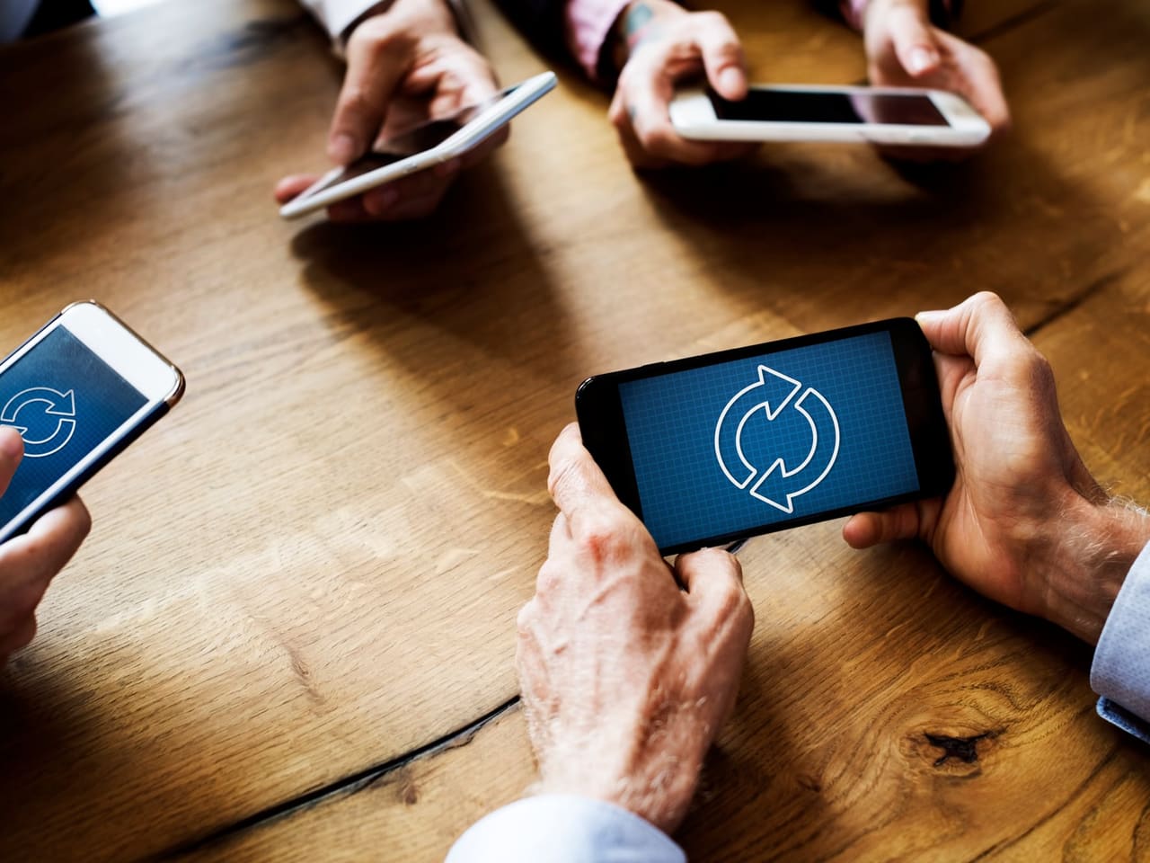 A team of colleagues using their smartphones